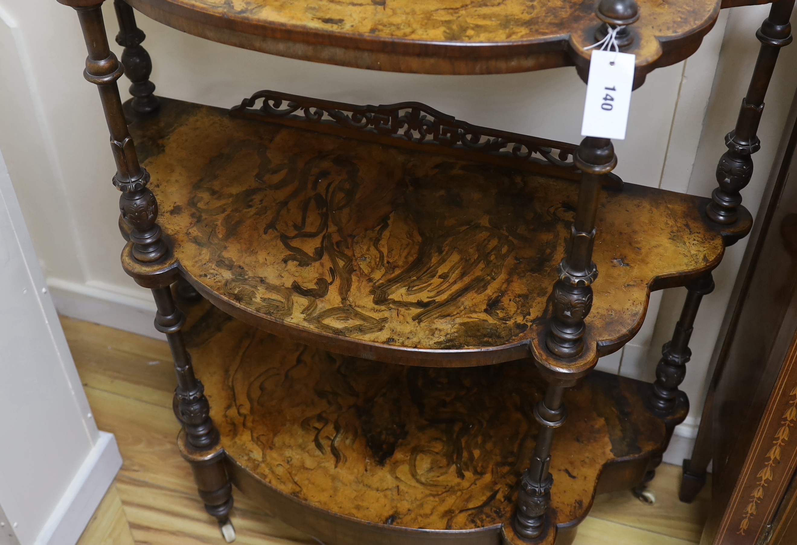 A Victorian walnut and simulated walnut three tier bow front mirror back whatnot, width 93cm, depth 36cm, height 140cm
